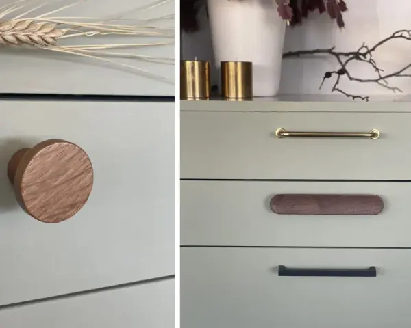 Detaljer från en målad byrå med olika handtag: ett runt i trä, ett mässingshandtag och ett avlångt i trä.